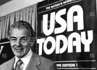 Al Neuharth, chairman of Gannett with logo of new newspaper (USA Today)