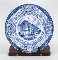 Photograph of a blue and white plate with a picture of the Old Library.