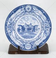 Photograph of a blue and white plate of the UT Brackenridge Hall 1890-1899. .