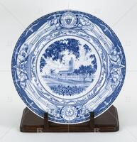 Photograph of a blue and white plate with a picture of the New Administration Building. .