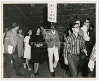 Photograph of students protesting, one holds a sign reading "I can die for my country but I can’t be served here," undated