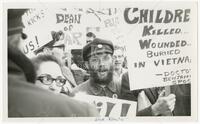 Dick Reavis and others with signs (Vietnam protest)