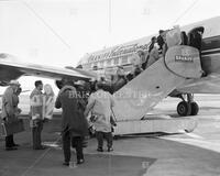 Longhorn Band members getting on plane