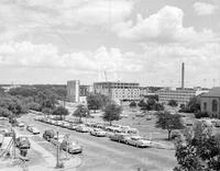 Outside of Engineering and Science Building with cars on campus