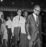 Photograph of Dwight Macdonald protesting with students outside Roy's Lounge