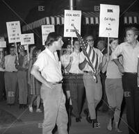 Photograph of Dwight Macdonald protesting with students outside Roy's Lounge