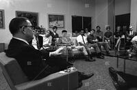 Photograph of Dr. Ransom talking to students at reception in Union