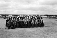 Photograph of University Chorus taken at 85 Trinity – backyard of Lakeside Retirement Home on Town Lake