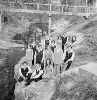 Photograph of Varsity Singers taken between the Drama and Art buildings