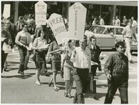 Photograph of protestors with signs