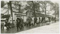 Photograph of students in snow on UT campus