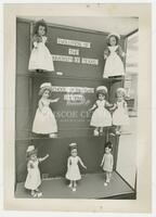 Photograph of the evolution of the UT school of nursing uniform as shown on dolls