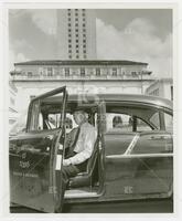 Photograph of Chief Allen R. Hamilton in one of two UT Traffic and Security patrol cars