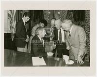 Photograph of Governor Mark White signing a proclamation congratulating the University Interscholastic League on its 75th year