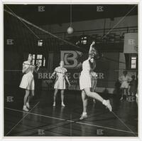 Photograph of group of ladies playing volleyball, undated