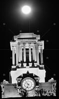 Photograph of UT Tower with full moon