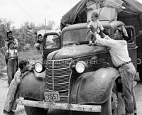 Family group moving from Texas to Wyoming for work in sugar beet fields, 1949