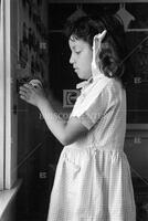 School girl sharpening a pencil. San Angelo, Texas.