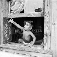 A baby who lives in a slum corral.