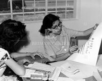 Checking proof pages at the Munguia printing shop