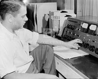 Control room operator at a Spanish language radio station.