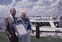 Photograph of Ann Richards holding a certificate, 1993
