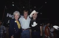 Photograph of Ann Richards, Robert Redford, and Jim Hightower at a campaign event, 1990