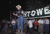 Photograph of Molly Ivins speaking at a campaign event for Jim Hightower, 1990