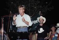 Photograph of Robert Redford speaking at a campaign event for Jim Hightower, 1990