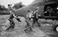 Photograph of U.S. Marines getting onto a helicopter, 1967