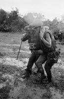 Photograph of U.S. Marines helping a wounded soldier, 1967