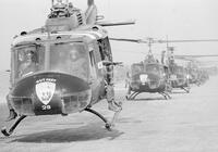 Photograph of helicopters from the 175th Assault Helicopter Company departing from a base, 1967