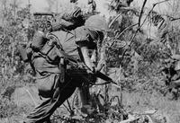 Photograph of a U.S. Marine taking cover, 1967