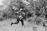 Photograph of a U.S. Marine running, 1967