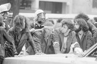 Photograph of police officers patting down protesters at the May Day protests, May 3, 1971