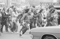 Photograph of protesters running during the May Day protests, May 3, 1971