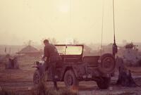 Photograph of a U.S. soldier and a jeep, 1966