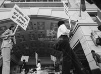 Photograph of a protest related to natural hair in the workplace, 1987