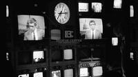 Photograph of Dan Rather on a monitor, 1987