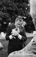 Photograph of George Bush holding a puppy, 1989