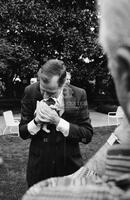 Photograph of George Bush holding a puppy, 1989