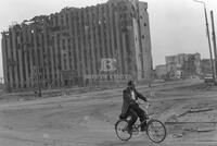 Photograph of a person riding a bike