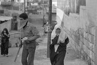 Photograph of a Palestinian girl crying in the street