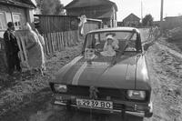 Photograph of a doll on a car