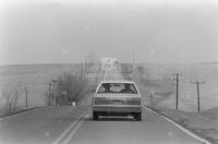 Photograph of a car driving through the Rosebud Reservation