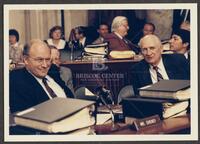 Color photograph of Jack Brooks speaking with a fellow representative, 1987