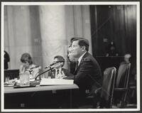 Black and white photograph of participants during the Iran-Contra trials, 1987