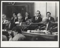 Black and white photograph of representatives working during the Iran-Contra trials, 1987