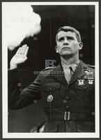 Black and white photograph of Lt. Col. Oliver North taking an oath during the Iran-Contra trials, July 1987
