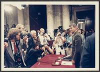 Color photograph of the press taking photos of Lt. Col. Oliver North during the Iran-Contra trials, July 1987